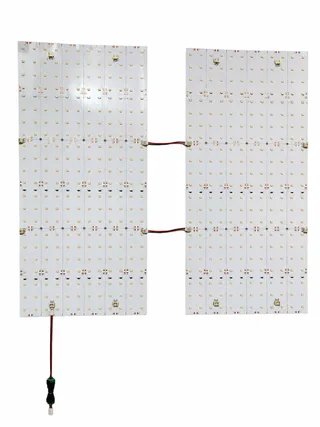 Two 24V LED sheets chained together with JST jumper cable plug-and-play connection
