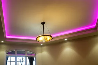 RGB LED strip ceiling cove lighting with purple ambient glow in modern interior design